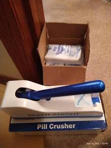 lot 381 image: Silent Knight Pill Crusher  Box of Pouches