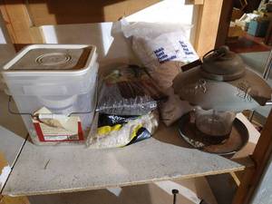 lot 560 image: Shelf of Bird Food, Feeder & Peat Rock