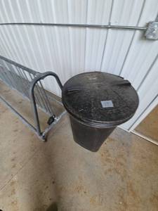 lot 17 image: Large Black Plastic Outdoor Trash Can with Lid