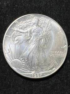 lot 63 image: 1987 AMERICAN SILVER EAGLE 1 TROY OZ .999 FINE SILVER