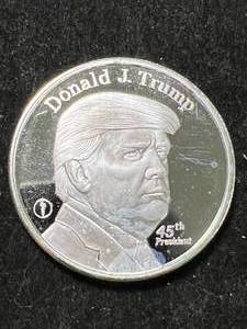 lot 90 image: 1 TROY OZ .999 FINE SILVER DONALD TRUMP ROUND