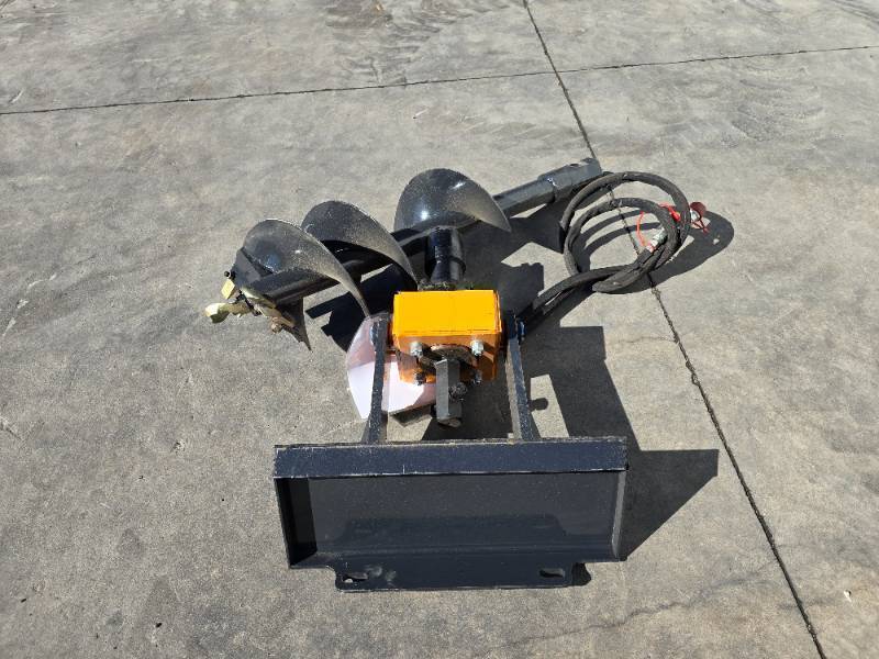 lot 79 image: Wolverine Mini Skid Steer Post Auger 12