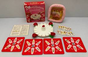 lot 21 image: Vintage 1980s Strawberry Shortcake Items Including Wall hanging & Berry-Go-Round Game