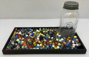 lot 57 image: Bottle Of Misc. Vintage Marbles (Some Glow Under UV Light)
