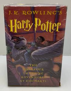 lot 1 image: JK Rowlings Harry Potter The First Four Thrilling Adeventures At Hogwarts Box Set (Factory Sealed)