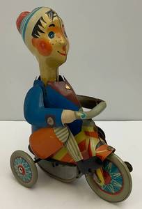 lot 233 image: Vintage Kovap Wind Up Tin Toy Bot On Tricycle (WORKS) No Key