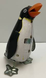 lot 237 image: 1980s  5.75 Tin Litho Rock And Roll Wind Up Penguin (Works) No Key