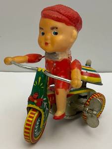 lot 239 image: Vintage Tin Wind Up Boy On Tricycle With Ringing Bell (Works) Made In China