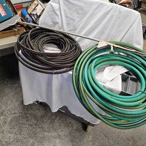 lot 80 image: Garden Hose and Sprinkler