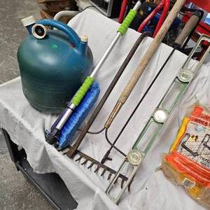 lot 97 image: Kerosene 5 Gallon Can and Prybar with Misc