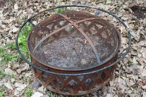 lot 30 image: Rustic Metal Fire Pit with Mesh Cover