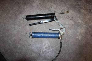 lot 57 image: Lot of 2 Manual Grease Guns - Black and Blue