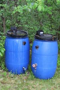 lot 85 image: Set of 2 Blue Plastic Rain Barrels with Spigots