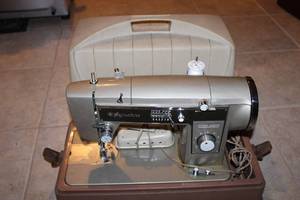 lot B-149 image: Signature Portable Sewing Machine with Hard Case