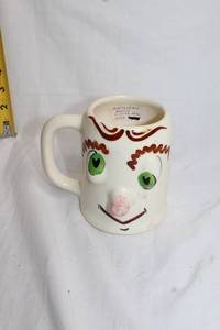 lot 81 image: Vintage Pfaltzgraff Mugsy Pickled Pete Mug 1956