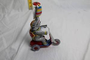 lot 94 image: Vintage Tin Elephant Wind-Up Toy on Tricycle