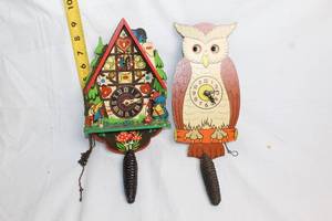 lot 172 image: Pair of Vintage Wooden Clock Pendulum Wall Decorations Owl and Cuckoo House Design