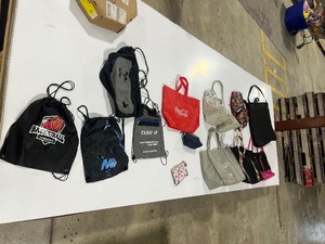 lot 28 image: 14 BAGS UNDER ARMOR, COCA COLA, MICKEY, & VICTORIA SECRET