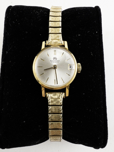 lot 97 image: Ladys Bucherer 17 Jewel Gold Tone Base Metal Mechanical Watch. Starts when wound