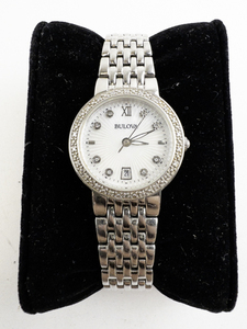 lot 100 image: Ladys Bulova sunburst dial with stones on the bezel, mop dial Silver Tone Base Metal Quartz Analog watch. New Battery Installed