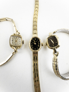 lot 138 image: Ladys Group of 3  Omega, Bulova, Geneva Gold Tone Base Metal Mechanical Watches. Does not run