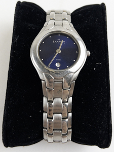lot 163 image: Ladys Skagen blue dial with date wheel silver tone stainless steel Quartz Analog watch. New battery