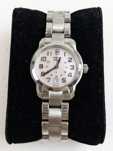lot 167 image: Ladys Swiss Army Pink dial watch with date silver tonestainless steel Quartz Analog watch. New battery