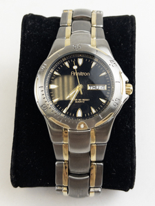 lot 175 image: Mens Armitron black dial with daydate two-tone base metal Quartz Analog watch. new battery