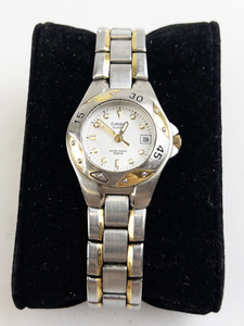 lot 176 image: Ladys Casio white dial with lumed dial markers and date two-tone base metal Quartz Analog watch. New battery