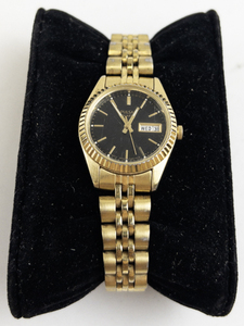 lot 177 image: Ladys Pulsar black dial with daydate and fluted bezel gold tone base metal Quartz Analog watch. New battery