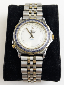 lot 215 image: Mens Timex Indiglo with compass bezel two-tone base metal Quartz Analog watch. new battery
