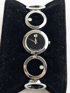 Lady's Movado repeating circle bracelet with stones studded and black dial silver tone stainless steel Quartz Analog watch. New Battery