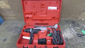 lot 36 image: Milwaukee Hammer Drill With Case and Some Bits