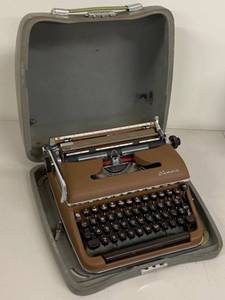 lot 9H image: Vintage Olympia Typewriter with Carrying Case