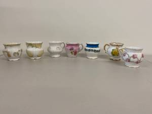 lot 41H image: Set of 7 Vintage Miniature Porcelain Vanity or Shaving Pitchers with Floral and Gilded Designs