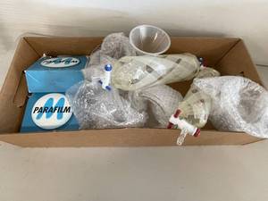 lot 115A image: Assorted Laboratory Equipment with Parafilm Rolls and Glass Flasks