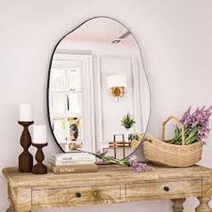 lot 22 image: XRAMFY 24 in. W x 32 in. H Irregular Modern Frameless MDF Wall Mirror Customer Returns See Pictures