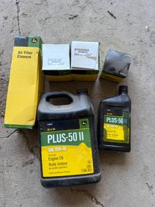 lot 110 image: Full Gallon & Quart John Deere 15w40 Oil & Filters