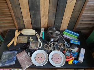 lot 81 image: Misc lot of all kinds of things,  Handcuffs, Vintage Rotary desk Phone, and more