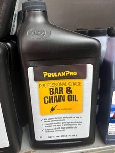 lot 8 image: 2 bottles of bar chain oil