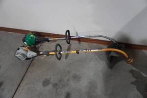 lot 30 image: Ryobi and Feather Lite Brand Gas Powered Weed Trimmers