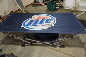 lot 17 image: Miller Light Themed Collapsible HammockCot With Under Bed Storage
