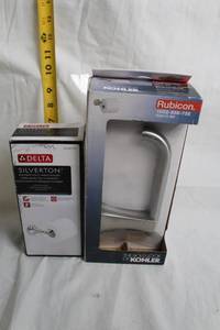lot 52 image: Delta Silverton and Kohler Rubicon Toilet Paper Holders