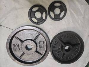 lot 43 image: Lot of a pair of 2.5LB 2-inch Weight Plates, one 25LB 2-Inch Plates and One 35LB 2-Inch Plates (USED)