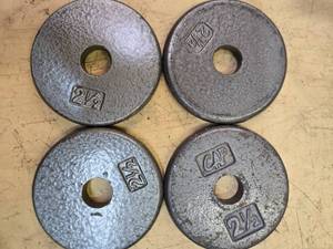 lot 74 image: Lot of four 2.5LB Weight Plates (USED)