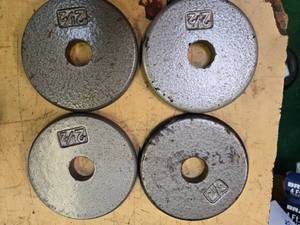 lot 76 image: Lot of four 2.5LB Weight Plates (USED)
