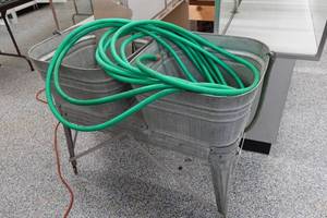 lot 337 image: Galvanized Rain Barrel with Stand and Hose