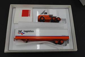 lot 372 image: Winross UFC Logistics Semi and Trailer 164 Scale Replica