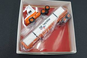 lot 375 image: Winross USF Logistics Semi Truck and Trailer 164 Scale Replica
