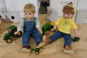lot 92 image: 2 Porcelain Dolls with John Deere Tractors